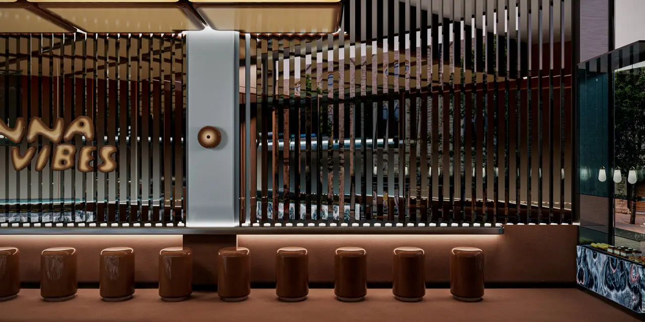 Cinnavibes A row of brown stools lines a counter in front of vertical metal slats, with a sign reading “LUNA VIBES” on the left wall in a modern interior setting, capturing the inviting ambience of Cinnamon Deserts Café—perfect for savouring their signature Cinnavibes cinnamon rolls. Cinnamon Rolls