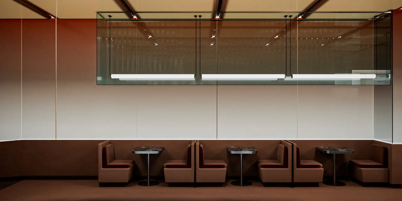 Cinnavibes Four brown booth seating sets with small tables are arranged in a row against a plain wall in the modern, minimalistic interior of Cinnamon Deserts Café, where guests can relax and enjoy signature cinnamon rolls whilst soaking up the warm Cinnavibes. Cinnamon Rolls