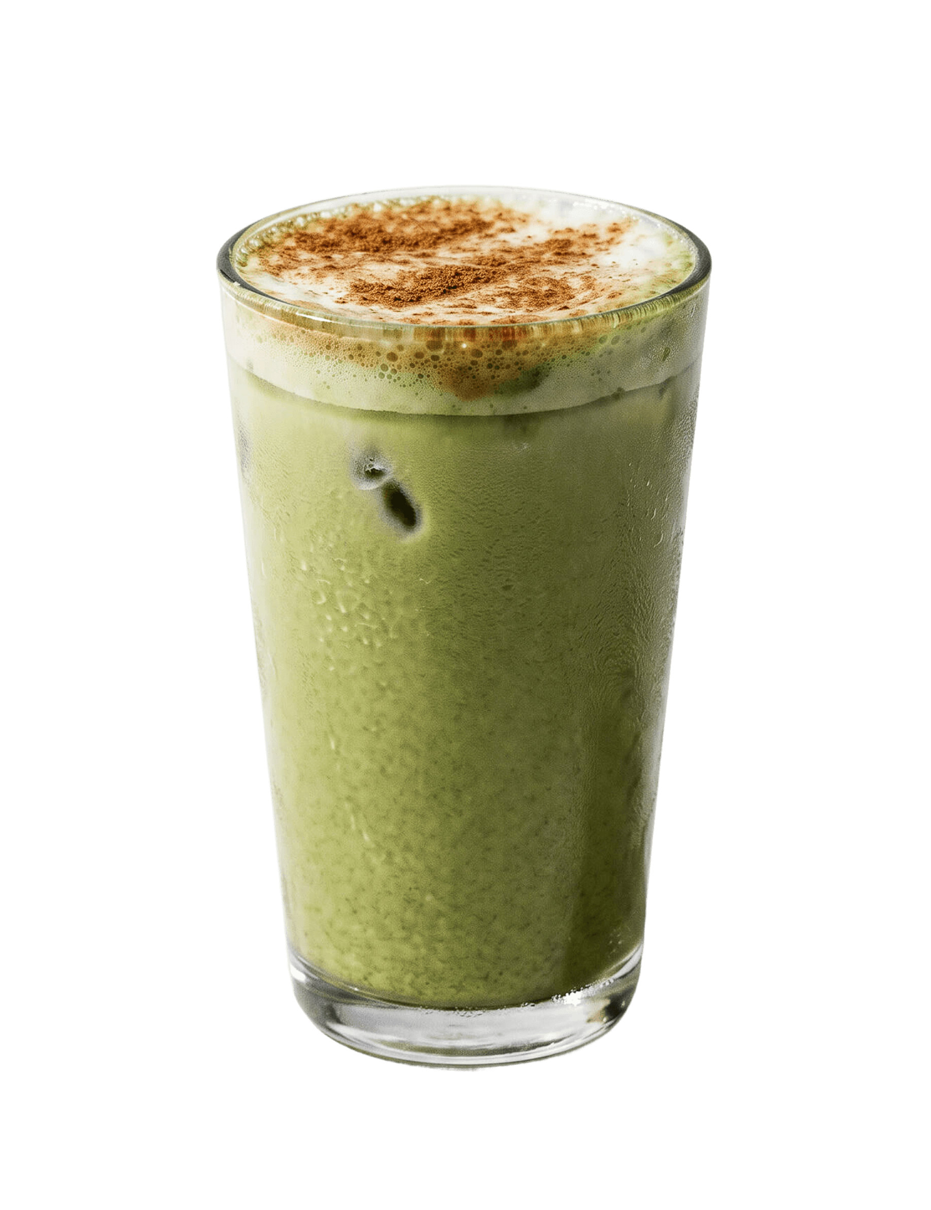 Cinnavibes A glass of iced matcha latte topped with cinnamon powder, reminiscent of the sweet aroma found at Cinnamon Deserts Café, features visible ice cubes and frothy milk on top, all set against a white background. Cinnamon Rolls