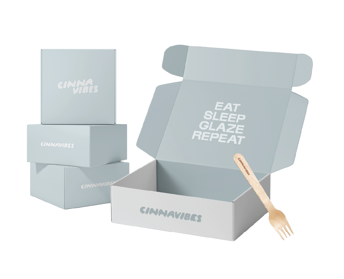 Cinnavibes Stacked and open light grey boxes labelled “CINNAVIBES” evoke the warm charm of a Cinnamon Deserts Café; the open box reads “EAT SLEEP GLAZE REPEAT” inside, with a small wooden fork beside it—a perfect invitation to indulge in fresh Cinnamon Rolls. Cinnamon Rolls